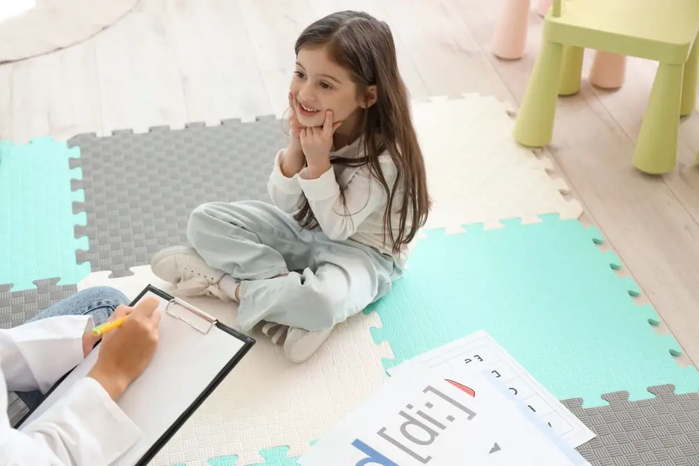 Speech pathology materials laid out for a session.