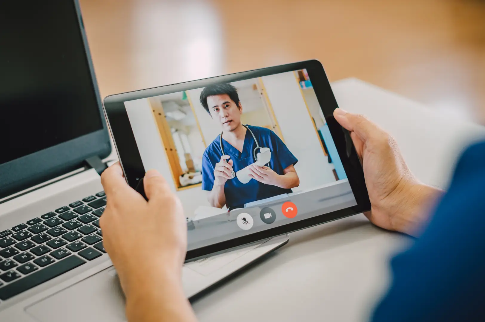 A GP conducting a telehealth consultation at an SMSG centre.